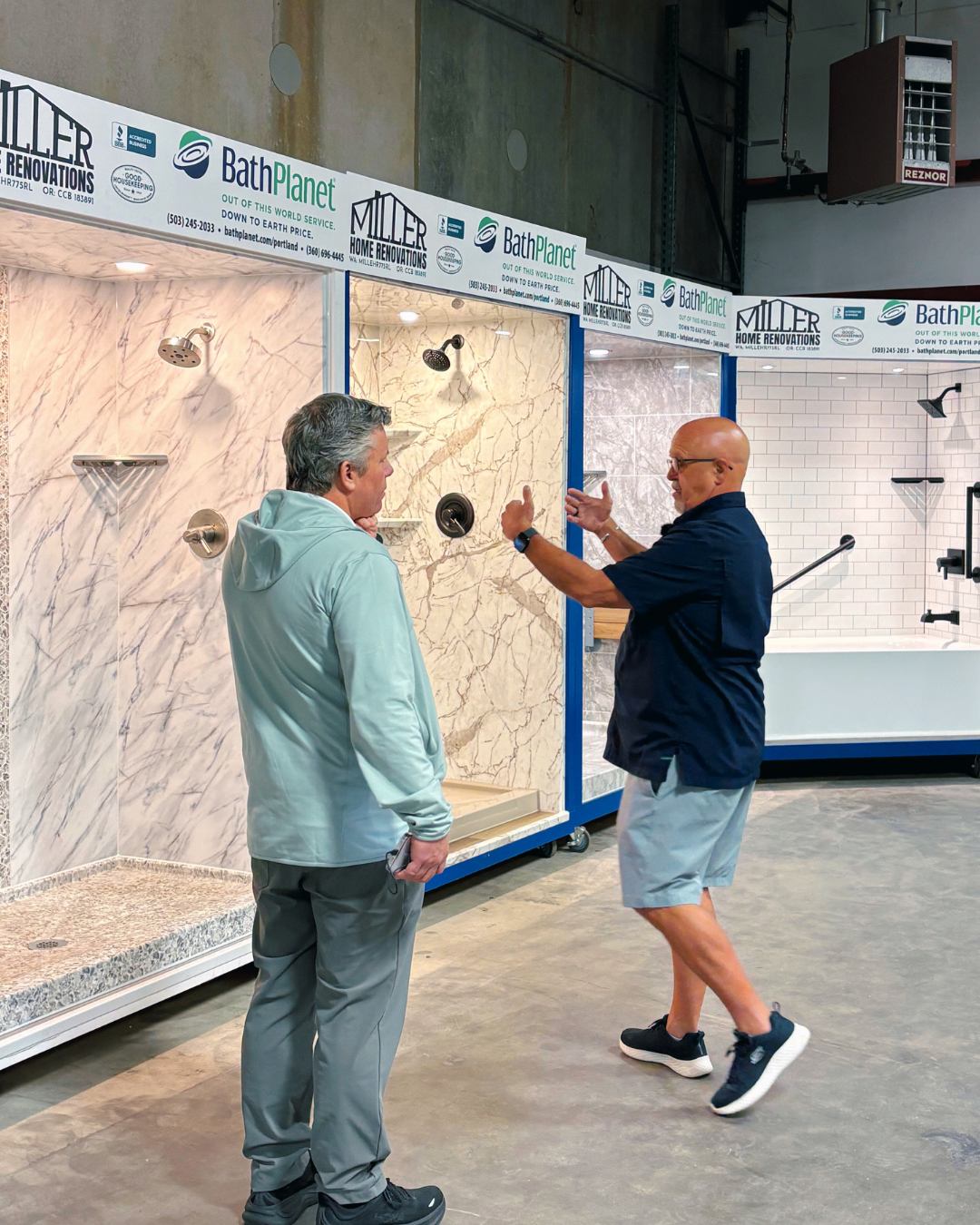 bathroom-remodeling-specialist-showing-a-shower-wall-sample-60103e97