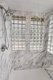 marble-look-shower-surround-installed-around-glass-block-win-9444866e